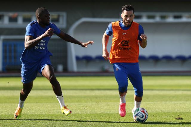 France's forward #24 Rayan Cherki (R) fights for the ball with France's defender #04 Dayot Upamecano during a training session at the national team training grounds in Clairefontaine-en-Yvelines, southwest of Paris, on June 1, 2026, as part of their preparation for the upcoming 2026 FIFA World Cup football tournament. (Photo by FRANCK FIFE / AFP)