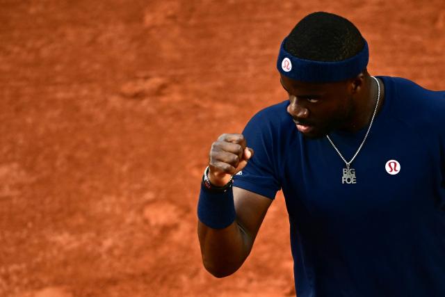 US Frances Tiafoe reacts to a point against Italy's Matteo Arnaldi during their men's singles match on day 9 of the French Open tennis tournament on Court Suzanne-Lenglen at the Roland-Garros Complex in Paris on June 1, 2026. (Photo by JULIEN DE ROSA / AFP)