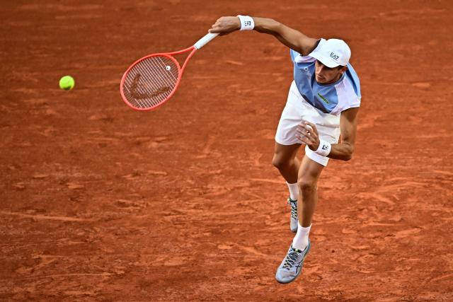 Italy's Matteo Arnaldi serves to US Frances Tiafoe during their men's singles match on day 9 of the French Open tennis tournament on Court Suzanne-Lenglen at the Roland-Garros Complex in Paris on June 1, 2026. (Photo by JULIEN DE ROSA / AFP)