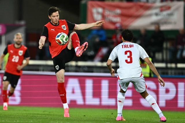 Austria's forward #11 Michael Gregoritsch (C) controls the ball next to Tunisia's defender #03 Montassar Talbi during the friendly football match between Austria and Tunisia in Vienna, Austria on June 1, 2026 ahead of the 2026 FIFA World Cup football tournament. (Photo by Joe Klamar / AFP)