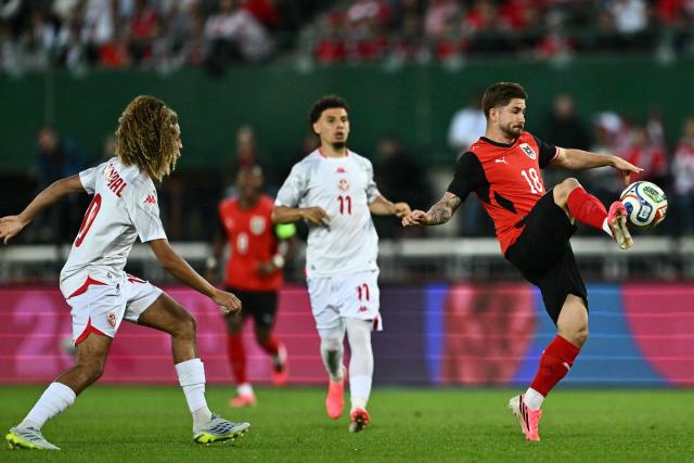 Austria's midfielder #18 Romano Schmid (R9 and Tunisia's midfielder #10 Hannibal Mejbri vie for the ball during the friendly football match between Austria and Tunisia in Vienna, Austria on June 1, 2026 ahead of the 2026 FIFA World Cup football tournament. (Photo by Joe Klamar / AFP)