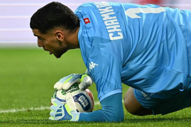 Tunisia's goalkeeper #01 Mouhib Chamakh makes a save during the friendly football match between Austria and Tunisia in Vienna, Austria on June 1, 2026 ahead of the 2026 FIFA World Cup football tournament. (Photo by Joe Klamar / AFP)