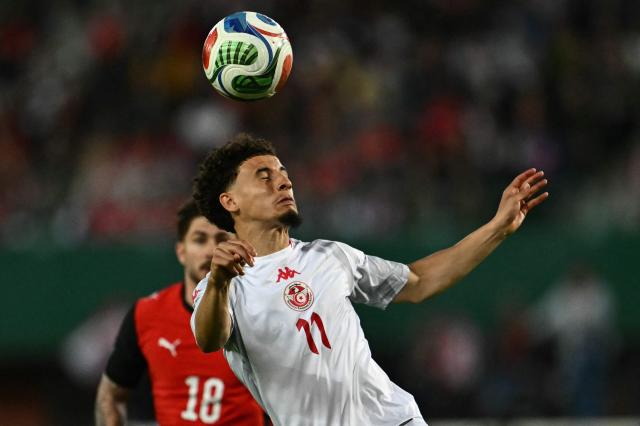Tunisia's forward #11 Ismael Gharbi heads the ball during the friendly football match between Austria and Tunisia in Vienna, Austria on June 1, 2026 ahead of the 2026 FIFA World Cup football tournament. (Photo by Joe Klamar / AFP)