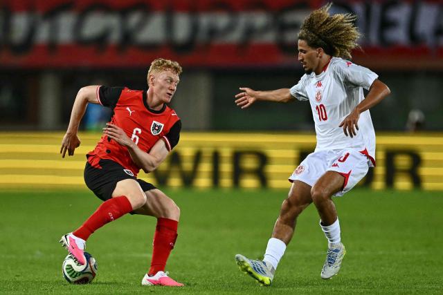 Austria's midfielder #06 Nicolas Seiwald (L) and Tunisia's midfielder #10 Hannibal Mejbri vie for the ball during the friendly football match between Austria and Tunisia in Vienna, Austria on June 1, 2026 ahead of the 2026 FIFA World Cup football tournament. (Photo by Joe Klamar / AFP)