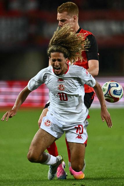 Tunisia's midfielder #10 Hannibal Mejbri is fouled by Austria's defender #15 Philipp Lienhart during the friendly football match between Austria and Tunisia in Vienna, Austria on June 1, 2026 ahead of the 2026 FIFA World Cup football tournament. (Photo by Joe Klamar / AFP)