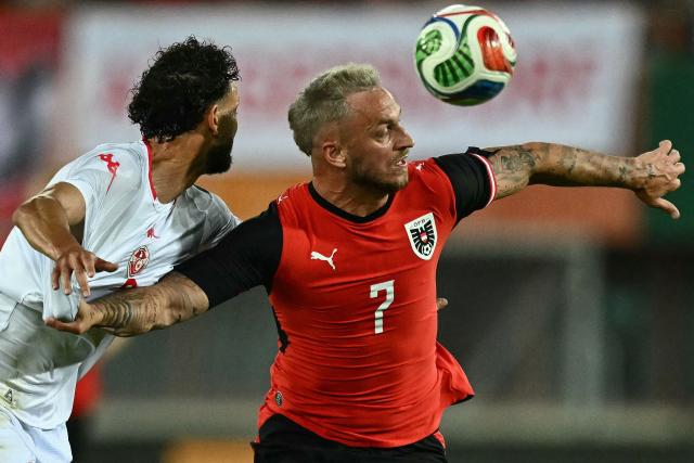 Austria's forward #07 Marko Arnautovic (R) and Tunisia's defender #03 Montassar Talbi vie for the ball during the friendly football match between Austria and Tunisia in Vienna, Austria on June 1, 2026 ahead of the 2026 FIFA World Cup football tournament. (Photo by Joe Klamar / AFP) / ALTERNATIVE CROP