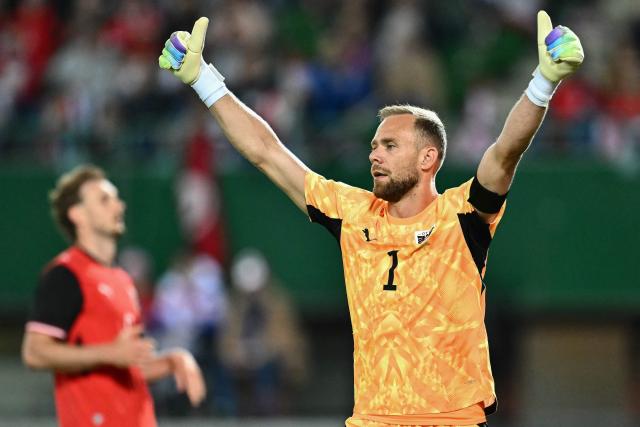 Austria's goalkeeper #01 Alexander Schlager celebrates after they scored the opening goal  during the friendly football match between Austria and Tunisia in Vienna, Austria on June 1, 2026 ahead of the 2026 FIFA World Cup football tournament. (Photo by Joe Klamar / AFP)