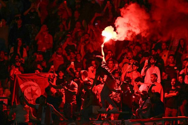 Tunisia fans light flares during the friendly football match between Austria and Tunisia in Vienna, Austria on June 1, 2026 ahead of the 2026 FIFA World Cup football tournament. (Photo by Joe Klamar / AFP)