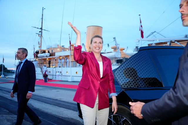 Denmark's acting Prime Minister Mette Frederiksen waves as she arrives to board the royal yacht Dannebrog at the Harbor during the royal couple's summer tour to Odense Municipality on June 1, 2026. Denmark's Prime Minister Mette Frederiksen said she had managed to form a left-leaning minority coalition government following months of talks after inconclusive elections in March. (Photo by Sebastian Elias Uth / Ritzau Scanpix / AFP) / Denmark OUT