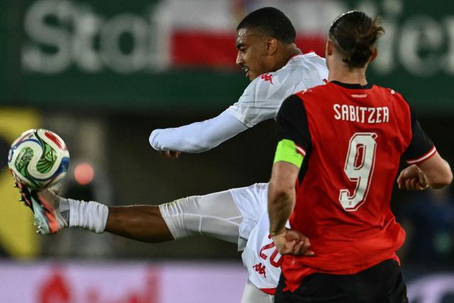 Tunisia's defender #20 Yan Valery (L) and Austria's forward #09 Marcel Sabitzer vie for the ball during the friendly football match between Austria and Tunisia in Vienna, Austria on June 1, 2026 ahead of the 2026 FIFA World Cup football tournament. (Photo by Joe Klamar / AFP)