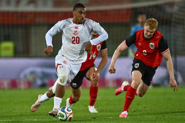 Tunisia's defender #20 Yan Valery (L) and Austria's midfielder #06 Nicolas Seiwald vie for the ball during the friendly football match between Austria and Tunisia in Vienna, Austria on June 1, 2026 ahead of the 2026 FIFA World Cup football tournament. (Photo by Joe Klamar / AFP)
