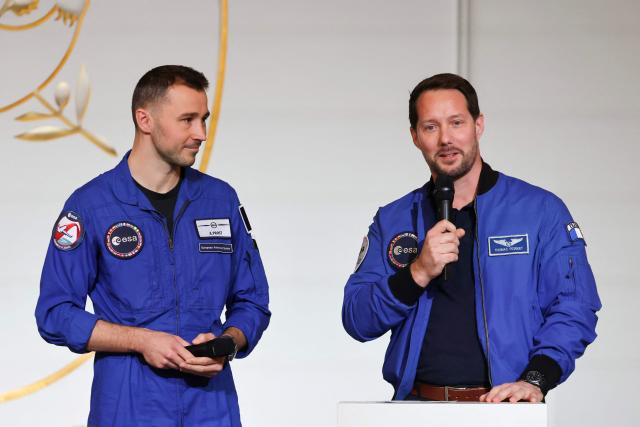 (FILES) ESA (European Space Agency) French astronaut Thomas Pesquet (R) next to French astronaut Arnaud Prost addresses the audience ahead of a public video conference with French astronaut Sophie Adenot ahead of her departure for the International Space Station, at the presidential Elysee Palace in Paris on February 5, 2026. France's President Emmanuel Macron announced on June 1, 2026 that the two French astronauts Thomas Pesquet and Arnaud Prost will go into space in 2027. (Photo by Ludovic MARIN / POOL / AFP)