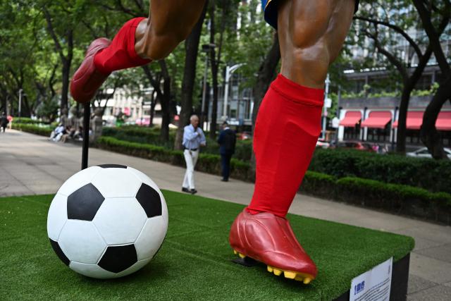 A view of a football of a giant sculpture, as part of the urban exhibition "Gigantes del Futbol" (Giants of Soccer) by Mexican artisans from the Zion Art Studio workshop, ahead of the FIFA 2026 World Cup in Mexico City on June 1, 2026. (Photo by Yuri CORTEZ / AFP)