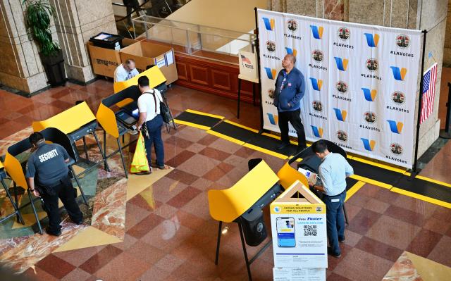 People vote at a polling location at the Metro Headquarters Building during California's state primary election in Los Angeles, California, on June 2, 2026. Californians go to the polls Tuesday in the first round of voting for a new governor, with a tight three-way race for two run-off spots, while people in Los Angeles will also be voting for a new mayor. The state's so-called "jungle primary" pits all comers against each other -- regardless of party -- with the top two vote-getters advancing to the November general election to replace term-limited Governor Gavin Newsom. (Photo by Frederic J. BROWN / AFP)