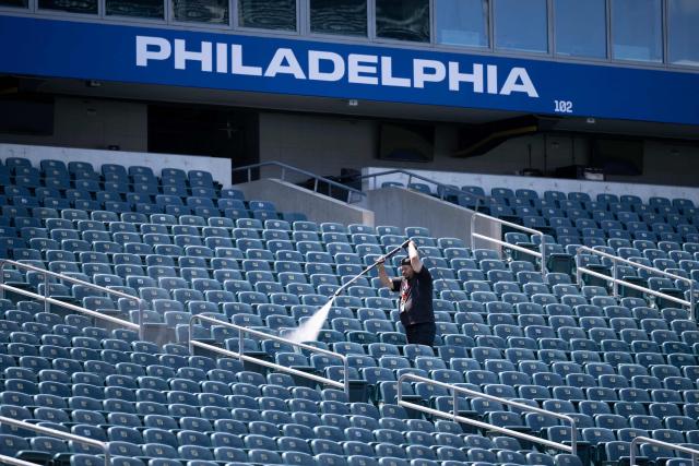 A worker pressure washes seats at Philadelphia Stadium (temporarily renamed from Lincoln Financial Field) ahead of the 2026 FIFA World Cup in Philadelphia, Pennsylvania, on June 1, 2026. (Photo by Brendan Smialowski / AFP)