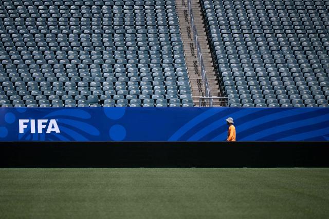 A worker walks along the pitch at Philadelphia Stadium (temporarily renamed from Lincoln Financial Field) ahead of the 2026 FIFA World Cup in Philadelphia, Pennsylvania, on June 1, 2026. (Photo by Brendan Smialowski / AFP)
