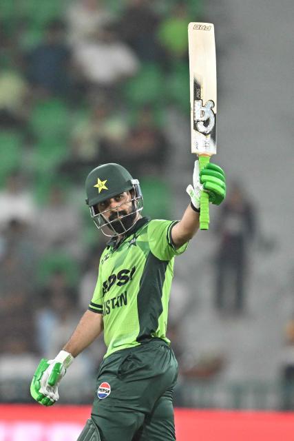 Pakistan's Shadab Khan celebrates after scoring half century (50 runs) during the second one-day international (ODI) cricket match between Pakistan and Australia at the Gaddafi Cricket Stadium in Lahore on June 2, 2026. (Photo by Arif ALI / AFP)