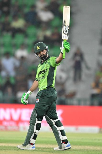 Pakistan's Shadab Khan celebrates after scoring half century (50 runs) during the second one-day international (ODI) cricket match between Pakistan and Australia at the Gaddafi Cricket Stadium in Lahore on June 2, 2026. (Photo by Arif ALI / AFP)