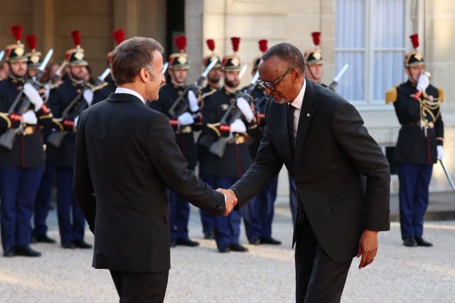 France's President Emmanuel Macron welcomes Rwanda's President Paul Kagame upon his arrival for a state dinner in his honor at the Elysee Presidential Palace, in Paris on June 2, 2026. France's president hailed France's "unprecedented" rapprochement with Rwanda as he unveiled a monument to victims of the 1994 genocide in the presence of the leader of the east African nation. (Photo by Ludovic MARIN / AFP)