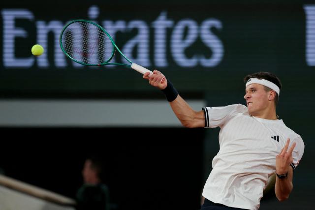 Czech Republic's Jakub Mensik plays a forehand return to Brazil's Joao Fonseca during their men's quarter final singles match on day 10 of the French Open tennis tournament on Court Philippe-Chatrier at the Roland-Garros Complex in Paris on June 2, 2026. (Photo by Thomas SAMSON / AFP)