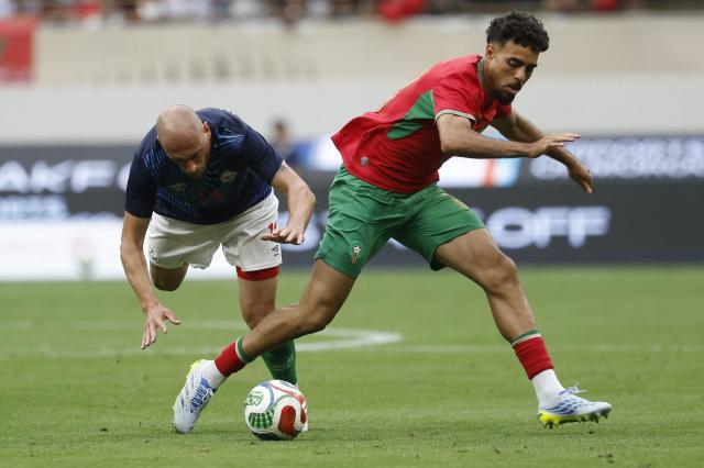 Madagascar's player #14 Clement Couturier  and Morocco's player #18 Chadi Riad fight for the ball during the friendly football match between Morocco and Madagascar at the Prince Moulay Abdellah Stadium in Rabat on June 2, 2026. (Photo by Abdel Majid BZIOUAT / AFP)