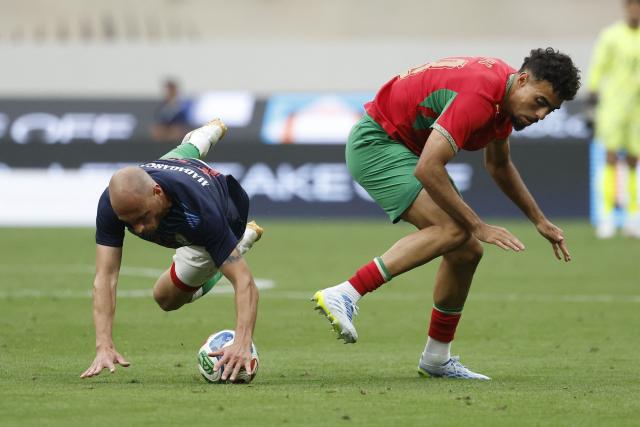 Madagascar's player #14 Clement Couturier and Morocco's player #18 Chadi Riad fight for the ball during the friendly football match between Morocco and Madagascar at the Prince Moulay Abdellah Stadium in Rabat on June 2, 2026. (Photo by Abdel Majid BZIOUAT / AFP)