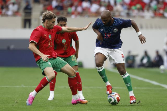 Madagascar's player #19 Hakim Abdallah is marked by Morocco's player #15 Samir El Mourabet during the friendly football match between Morocco and Madagascar at the Prince Moulay Abdellah Stadium in Rabat on June 2, 2026. (Photo by Abdel Majid BZIOUAT / AFP)
