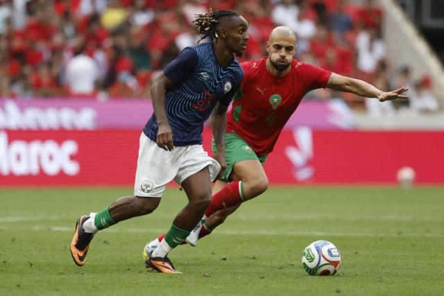 Madagascar's player #10 Johan N'Zi vies for the ball with Morocco's player #04 Sofyan Amrabat during the friendly football match between Morocco and Madagascar at the Prince Moulay Abdellah Stadium in Rabat on June 2, 2026. (Photo by Abdel Majid BZIOUAT / AFP)