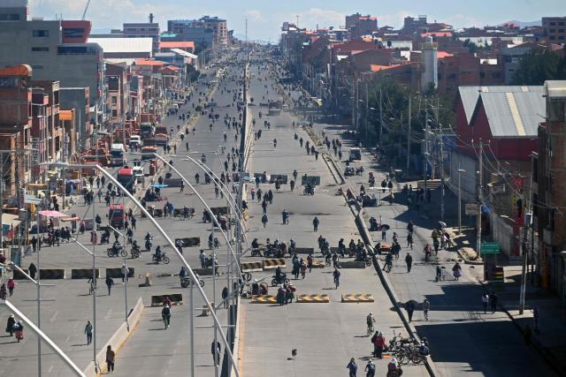 Anti-government demonstrators hold a road blockade in the Rio Seco area of El Alto, Bolivia, on June 2, 2026, following days of protests amid growing political tensions and supply shortages affecting different regions of the country. Since last May, workers, peasants, miners, transport workers, and teachers have been calling for urgent action to confront the country’s most severe economic crisis in forty years, and their demands include concrete economic measures as well as the resignation of President Rodrigo Paz. (Photo by Marvin RECINOS / AFP)