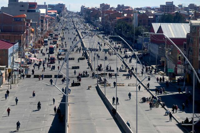 Anti-government demonstrators maintain a road blockade in the Rio Seco area of El Alto, Bolivia, on June 2, 2026, following days of protests amid growing political tensions and supply shortages affecting different regions of the country. Since last May, workers, peasants, miners, transport workers, and teachers have been calling for urgent action to confront the countrys most severe economic crisis in forty years, and their demands include concrete economic measures as well as the resignation of President Rodrigo Paz. (Photo by Marvin RECINOS / AFP)