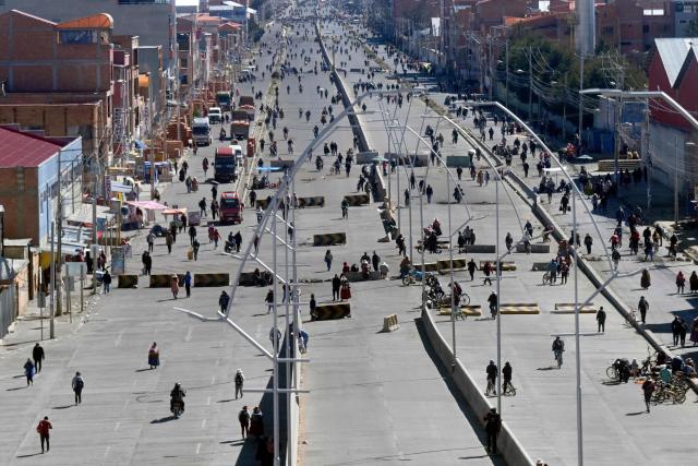 Anti-government demonstrators hold a road blockade in the Rio Seco area of El Alto, Bolivia, on June 2, 2026, following days of protests amid growing political tensions and supply shortages affecting different regions of the country. Since last May, workers, peasants, miners, transport workers, and teachers have been calling for urgent action to confront the country’s most severe economic crisis in forty years, and their demands include concrete economic measures as well as the resignation of President Rodrigo Paz. (Photo by Marvin RECINOS / AFP)