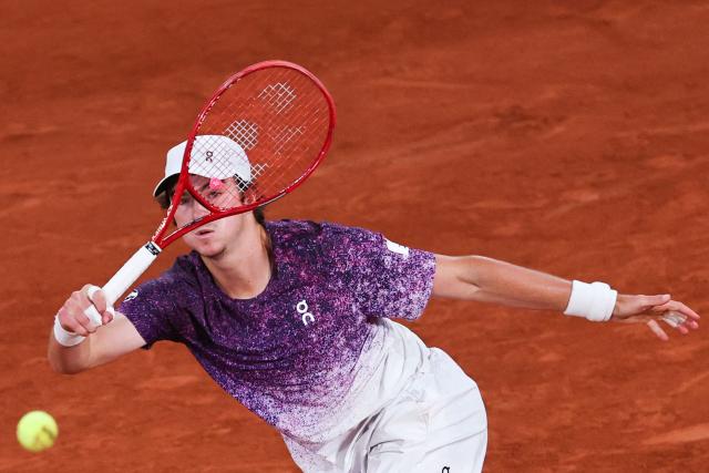 Brazil's Joao Fonseca plays a forehand return to Czech Republic's Jakub Mensik during their men's quarter final singles match on day 10 of the French Open tennis tournament on Court Philippe-Chatrier at the Roland-Garros Complex in Paris on June 2, 2026. (Photo by Anne-Christine POUJOULAT / AFP)
