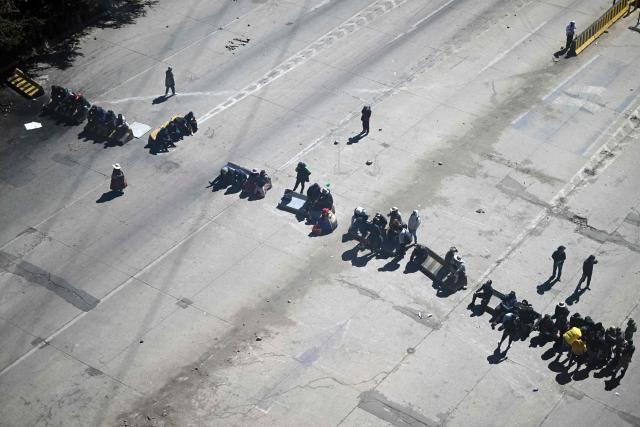 Anti-government demonstrators hold a road blockade in the La Ceja area of El Alto, Bolivia, on June 2, 2026, following days of protests amid growing political tensions and supply shortages affecting different regions of the country. Since last May, workers, peasants, miners, transport workers, and teachers have been calling for urgent action to confront the country’s most severe economic crisis in forty years, and their demands include concrete economic measures as well as the resignation of President Rodrigo Paz. (Photo by Marvin RECINOS / AFP)