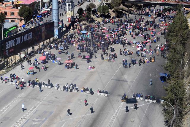 Anti-government demonstrators hold a road blockade in the La Ceja area of El Alto, Bolivia, on June 2, 2026, following days of protests amid growing political tensions and supply shortages affecting different regions of the country. Since last May, workers, peasants, miners, transport workers, and teachers have been calling for urgent action to confront the country’s most severe economic crisis in forty years, and their demands include concrete economic measures as well as the resignation of President Rodrigo Paz. (Photo by Marvin RECINOS / AFP)