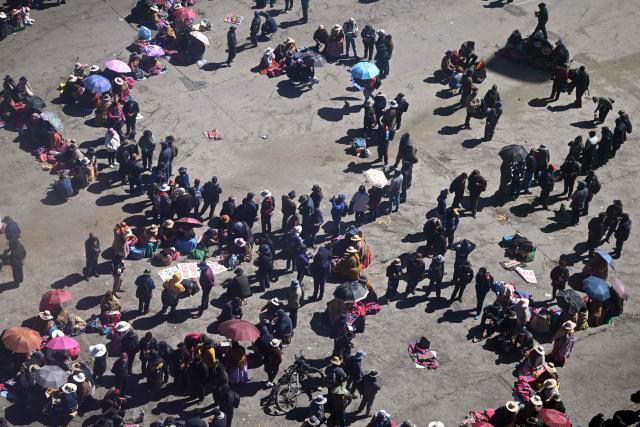 Anti-government demonstrators hold a road blockade in the La Ceja area of El Alto, Bolivia, on June 2, 2026, following days of protests amid growing political tensions and supply shortages affecting different regions of the country. Since last May, workers, peasants, miners, transport workers, and teachers have been calling for urgent action to confront the country’s most severe economic crisis in forty years, and their demands include concrete economic measures as well as the resignation of President Rodrigo Paz. (Photo by Marvin RECINOS / AFP)
