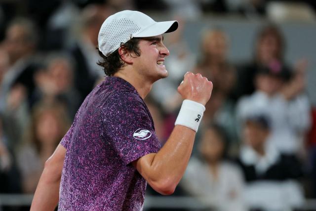 Brazil's Joao Fonseca reacts after a point as he plays against Czech Republic's Jakub Mensik during their men's quarter final singles match on day 10 of the French Open tennis tournament on Court Philippe-Chatrier at the Roland-Garros Complex in Paris on June 2, 2026. (Photo by Thomas SAMSON / AFP)