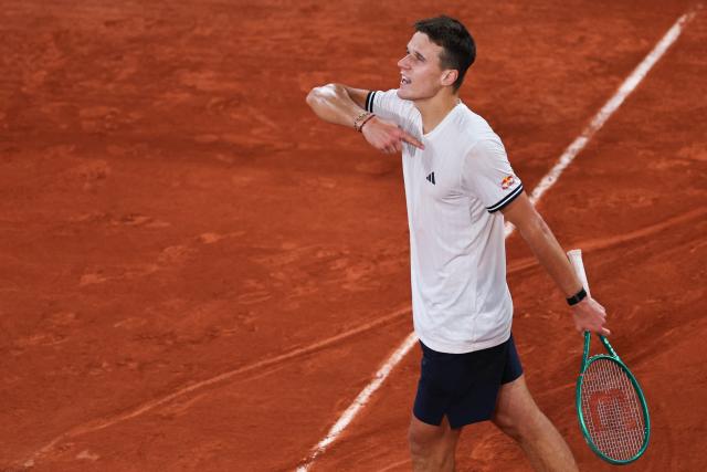 Czech Republic's Jakub Mensik celebrates after winning against Brazil's Joao Fonseca at the end of their men's quarter final singles match on day 10 of the French Open tennis tournament on Court Philippe-Chatrier at the Roland-Garros Complex in Paris on June 2, 2026. (Photo by Anne-Christine POUJOULAT / AFP)
