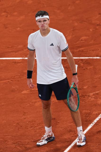 Czech Republic's Jakub Mensik celebrates after winning against Brazil's Joao Fonseca at the end of their men's quarter final singles match on day 10 of the French Open tennis tournament on Court Philippe-Chatrier at the Roland-Garros Complex in Paris on June 2, 2026. (Photo by Anne-Christine POUJOULAT / AFP)