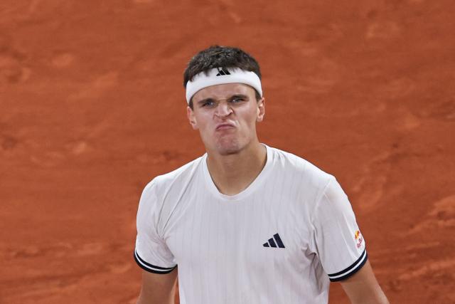 Czech Republic's Jakub Mensik celebrates after winning against Brazil's Joao Fonseca at the end of their men's quarter final singles match on day 10 of the French Open tennis tournament on Court Philippe-Chatrier at the Roland-Garros Complex in Paris on June 2, 2026. (Photo by Anne-Christine POUJOULAT / AFP)