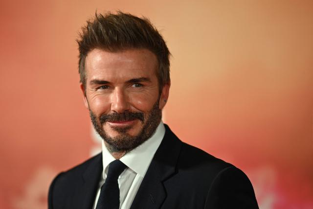 (FILES) Former Manchester United footballer David Beckham poses on the red carpet upon arrival to attend the world premiere of the documentary '99', in Manchester, northern England on May 9, 2024. Soccer star David Beckham will receive his star on the Hollywood Walk of Fame on June 12, one day after the start of the North American World Cup, the organization in charge of the famous boulevard reported on June 2. Tom Cruise and Victoria Beckham, “Posh Spice,” businesswoman and wife of the former British midfielder, will be the speakers at the ceremony honoring the former Manchester United and Real Madrid player. (Photo by Oli SCARFF / AFP)