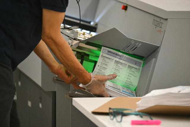 An election worker conducts ballot tabulation at the Los Angeles County Ballot Processing Center during California's state primary election in the City of Industry, California, on June 2, 2026. Californians go to the polls Tuesday in the first round of voting for a new governor, with a tight three-way race for two run-off spots, while people in Los Angeles will also be voting for a new mayor. The state's so-called "jungle primary" pits all comers against each other -- regardless of party -- with the top two vote-getters advancing to the November general election to replace term-limited Governor Gavin Newsom. (Photo by Patrick T. Fallon / AFP)