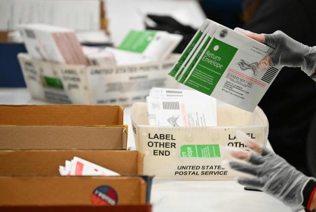 Election workers process mail-in ballots at the Los Angeles County Ballot Processing Center during California's state primary election in the City of Industry, California, on June 2, 2026. Californians go to the polls Tuesday in the first round of voting for a new governor, with a tight three-way race for two run-off spots, while people in Los Angeles will also be voting for a new mayor. The state's so-called "jungle primary" pits all comers against each other -- regardless of party -- with the top two vote-getters advancing to the November general election to replace term-limited Governor Gavin Newsom. (Photo by Patrick T. Fallon / AFP)