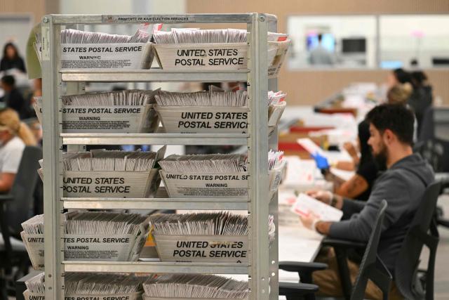 Election workers conduct ballot tabulation at the Los Angeles County Ballot Processing Center during California's state primary election in the City of Industry, California, on June 2, 2026. Californians go to the polls Tuesday in the first round of voting for a new governor, with a tight three-way race for two run-off spots, while people in Los Angeles will also be voting for a new mayor. The state's so-called "jungle primary" pits all comers against each other -- regardless of party -- with the top two vote-getters advancing to the November general election to replace term-limited Governor Gavin Newsom. (Photo by Patrick T. Fallon / AFP)