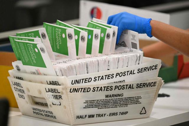 An election worker processes mail-in ballots at the Los Angeles County Ballot Processing Center during California's state primary election in the City of Industry, California, on June 2, 2026. Californians go to the polls Tuesday in the first round of voting for a new governor, with a tight three-way race for two run-off spots, while people in Los Angeles will also be voting for a new mayor. The state's so-called "jungle primary" pits all comers against each other -- regardless of party -- with the top two vote-getters advancing to the November general election to replace term-limited Governor Gavin Newsom. (Photo by Patrick T. Fallon / AFP)