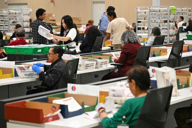 Election workers conduct ballot tabulation at the Los Angeles County Ballot Processing Center during California's state primary election in the City of Industry, California, on June 2, 2026. Californians go to the polls Tuesday in the first round of voting for a new governor, with a tight three-way race for two run-off spots, while people in Los Angeles will also be voting for a new mayor. The state's so-called "jungle primary" pits all comers against each other -- regardless of party -- with the top two vote-getters advancing to the November general election to replace term-limited Governor Gavin Newsom. (Photo by Patrick T. Fallon / AFP)
