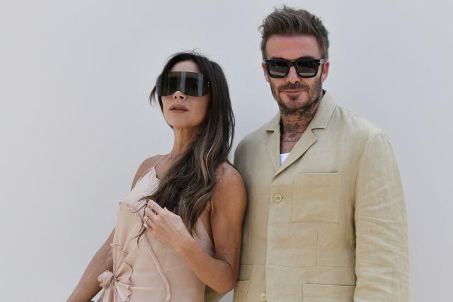 (FILES) British former football player David Beckham (R) and British singer and fashion designer Victoria Beckham (L) poses for photographs as they arrive at the Jacquemus Menswear Spring-Summer 2024 show as part of the Paris Fashion Week, at the Chateau de Versailles, in Versailles, southwest of Paris, on June 26, 2023. Soccer star David Beckham will receive his star on the Hollywood Walk of Fame on June 12, one day after the start of the North American World Cup, the organization in charge of the famous boulevard reported on June 2. Tom Cruise and Victoria Beckham, “Posh Spice,” businesswoman and wife of the former British midfielder, will be the speakers at the ceremony honoring the former Manchester United and Real Madrid player. (Photo by JULIEN DE ROSA / AFP)