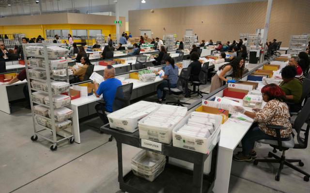 Election workers conduct ballot tabulation at the Los Angeles County Ballot Processing Center during California's state primary election in the City of Industry, California, on June 2, 2026. Californians go to the polls Tuesday in the first round of voting for a new governor, with a tight three-way race for two run-off spots, while people in Los Angeles will also be voting for a new mayor. The state's so-called "jungle primary" pits all comers against each other -- regardless of party -- with the top two vote-getters advancing to the November general election to replace term-limited Governor Gavin Newsom. (Photo by Patrick T. Fallon / AFP)