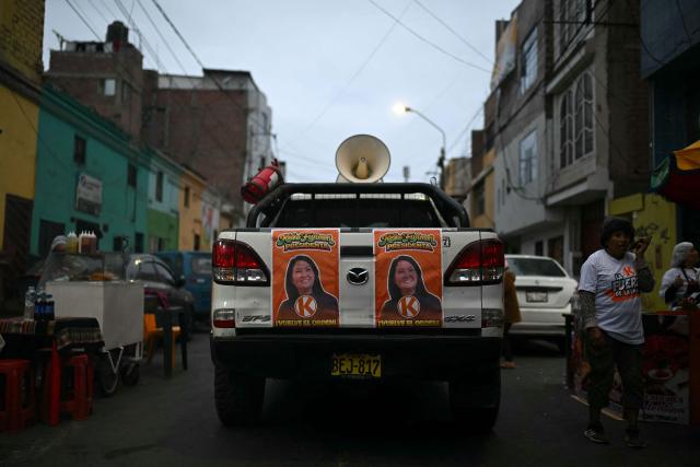 Campaign posters for Peru's presidential candidate for the Fuerza Popular party, Keiko Fujimori, are displayed on a pickup truck ahead of a campaign rally in Huacho, north of Lima, Peru on June 2, 2026. Peruvians will choose on June 7, 2026 their president from between the right-wing Keiko Fujimori, heir to a political dynasty that divides the nation, and the left-wing Roberto Sánchez: two diametrically opposed visions for a country plagued by instability and crime. (Photo by ERNESTO BENAVIDES / AFP)