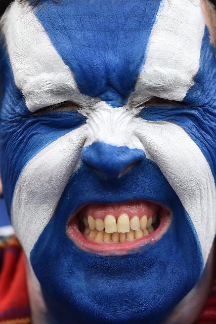 (FILES) A member of the Tartan Army poses for a picture ahead of the friendly international football match between Scotland and Ivory Coast at the Hill Dickinson Stadium in Liverpool, north west England on March 31, 2026. "No Scotland, no party" is a popular refrain of the Tartan Army and for the first time in 28 years the World Cup will be blessed with their blend of noise, colour and passion. (Photo by PETER POWELL / AFP)