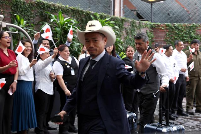 Japan's defender Yuto Nagatomo waves as he arrives at the Live Aqua hotel in Monterrey, Mexico on June 2, 2026, ahead of the FIFA 2026 World Cup football tournament. (Photo by Julio Cesar AGUILAR / AFP)
